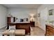 Well-lit main bedroom with a cozy bed, classic furnishings, and neutral tones at 5299 Noble Village Way, Lilburn, GA 30047