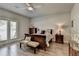Serene main bedroom featuring a cozy bed, French doors, and elegant decor at 5299 Noble Village Way, Lilburn, GA 30047