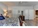Spacious main bedroom featuring wood floors, classic furniture, and ample closet space at 5299 Noble Village Way, Lilburn, GA 30047