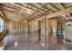Spacious unfinished basement with framed walls, smooth concrete floors, and exposed ceiling beams at 208 Idylwilde Way, Canton, GA 30115
