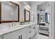Elegant bathroom featuring double sink vanity, framed mirrors, and an adjoining bedroom at 208 Idylwilde Way, Canton, GA 30115