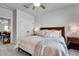 Bright bedroom with a ceiling fan, closet, neutral walls, plush carpet and a comfortable bed at 208 Idylwilde Way, Canton, GA 30115