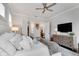 Comfortable bedroom showcasing ample pillows, neutral tones and natural light at 208 Idylwilde Way, Canton, GA 30115
