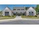 Beautiful clubhouse facade with gray brick, large windows, and landscaped entrance at 208 Idylwilde Way, Canton, GA 30115