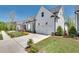 Charming white two-story home with a spacious driveway and manicured lawn at 208 Idylwilde Way, Canton, GA 30115