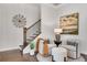 Cozy foyer with staircase, decorative windmill, and a seating area at 208 Idylwilde Way, Canton, GA 30115