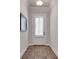 Hallway featuring a white door with shutter blinds and decorative flooring at 208 Idylwilde Way, Canton, GA 30115