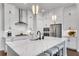 Modern kitchen featuring a marble island and stainless steel appliances at 208 Idylwilde Way, Canton, GA 30115