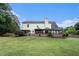 Expansive backyard with patio, landscaping, and mature trees at 25 Skylar Dr, Covington, GA 30016