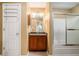 Bathroom with vanity, mirror, and walk-in shower at 25 Skylar Dr, Covington, GA 30016