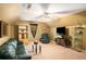 Cozy living room with ceiling fan, vaulted ceiling, and large seating area at 25 Skylar Dr, Covington, GA 30016