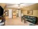Large living room with comfortable seating, vaulted ceiling, and ceiling fan at 25 Skylar Dr, Covington, GA 30016