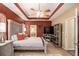 Spacious main bedroom with tray ceiling and access to ensuite bath at 25 Skylar Dr, Covington, GA 30016