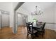 Bright dining room featuring hardwood floors and stylish chandelier at 2701 Gentry Dr, Douglasville, GA 30135
