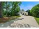A beautiful two-story house is displayed with well-maintained landscaping and a long driveway at 2701 Gentry Dr, Douglasville, GA 30135