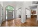 Grand foyer showcasing hardwood floors, abundant natural light, and access to dining and kitchen at 2701 Gentry Dr, Douglasville, GA 30135
