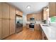 Spacious kitchen featuring stainless steel appliances, wooden cabinetry, and sleek countertops at 2701 Gentry Dr, Douglasville, GA 30135