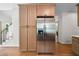 Kitchen with stainless steel fridge, modern cabinets, and easy access to stairs at 2701 Gentry Dr, Douglasville, GA 30135