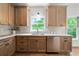 Well-lit kitchen featuring stainless steel dishwasher and stylish cabinetry at 2701 Gentry Dr, Douglasville, GA 30135