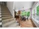 Cozy living room featuring a stairway, hardwood floors, and sun-drenched windows at 2701 Gentry Dr, Douglasville, GA 30135