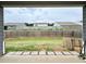 Spacious backyard with lush green grass, a wood fence, and a patio area, ideal for outdoor activities at 3785 Newbury Place Dr, Loganville, GA 30052