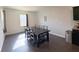 Bright dining room with seating for six, natural light, and hardwood floors at 3785 Newbury Place Dr, Loganville, GA 30052