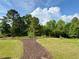 Community dog park with mulch path and plenty of room for dogs to run and play at 3785 Newbury Place Dr, Loganville, GA 30052