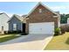 Inviting single-Gathering home showcasing well-kept lawn and an attached two-car garage at 3785 Newbury Place Dr, Loganville, GA 30052