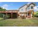 View of a two story home's backyard with a multi-level deck and stairs leading to a lawn at 405 Maple Rdg, White, GA 30184