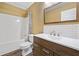 Updated bathroom featuring modern vanity, large mirror, and tub with shower at 405 Maple Rdg, White, GA 30184