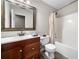 Bathroom featuring a wood vanity, tub with shower, and framed mirror at 405 Maple Rdg, White, GA 30184