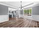 Elegant dining room with wainscoting and views into the kitchen at 405 Maple Rdg, White, GA 30184