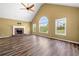 Spacious living room with vaulted ceiling, fireplace, and large windows at 405 Maple Rdg, White, GA 30184