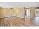 Spacious living room featuring hardwood floors, ceiling fan, and ample natural light at 405 Maple Rdg, White, GA 30184