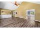 Bright living room with wood floors and view into the dining room at 405 Maple Rdg, White, GA 30184