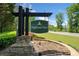 Entrance sign for Highland View, with stone base and professional landscaping at 405 Maple Rdg, White, GA 30184