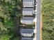 Overhead view of modern homes showing roof lines and landscaping with neighboring streets at 506 Tallapoosa Trl, Woodstock, GA 30188