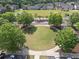 A bird's-eye view of the community park, featuring lush green space and walking paths at 506 Tallapoosa Trl, Woodstock, GA 30188