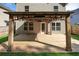 View of a backyard deck, featuring a stylish pergola, outdoor lights, and artificial turf grass at 506 Tallapoosa Trl, Woodstock, GA 30188