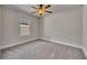 Bedroom featuring neutral paint, carpet floors, a window with blinds, and a ceiling fan at 506 Tallapoosa Trl, Woodstock, GA 30188