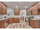 Well-equipped kitchen with stainless steel appliances, granite countertops, and ample cabinet space at 506 Tallapoosa Trl, Woodstock, GA 30188