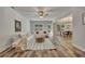 Spacious living room with wood floors, plenty of natural light, and open access to dining area at 506 Tallapoosa Trl, Woodstock, GA 30188