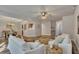 Bright, open living room showcasing wood-look floors and views to the dining room and kitchen at 506 Tallapoosa Trl, Woodstock, GA 30188