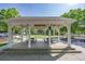 Charming community picnic pavilion with tables and ample space for gatherings and outdoor enjoyment at 506 Tallapoosa Trl, Woodstock, GA 30188