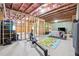 Unfinished basement with exposed ceiling beams, concrete floor and stud frame walls at 6375 Haystack Ct, Cumming, GA 30040