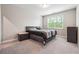 Neutral bedroom with carpet flooring, natural light, and closet at 6375 Haystack Ct, Cumming, GA 30040