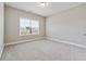 This bedroom features neutral walls, carpet and a large window with blinds at 6375 Haystack Ct, Cumming, GA 30040