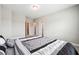 Neutral bedroom with connecting doors and a comfortable looking queen bed at 6375 Haystack Ct, Cumming, GA 30040