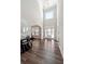 Grand two-story foyer featuring a modern chandelier, and wood-look flooring, creating a welcoming and elegant entrance at 6375 Haystack Ct, Cumming, GA 30040