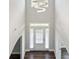 Grand two-story foyer with decorative chandelier and staircase at 6375 Haystack Ct, Cumming, GA 30040